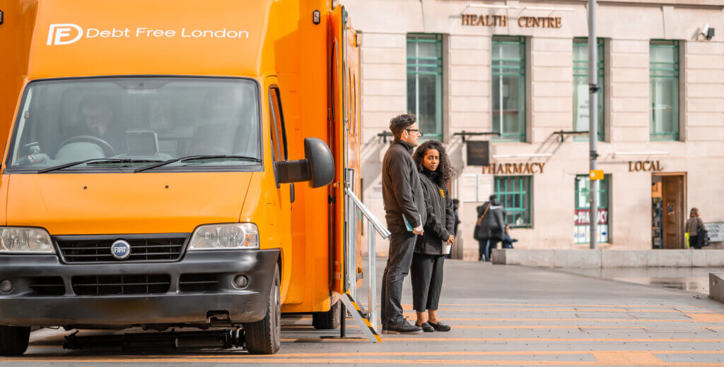 Debt Free London orange exhibition vehicle